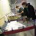 Volunteer Laura Woolley, of Ann Arbor, left, and Clinic Manager Bailey Hughes prepare food for injured birds recovering at the Bird Center of Washtenaw County on Tuesday morning. Melanie Maxwell I AnnArbor.com